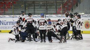 Custom Hockey Jerseys Team photo of players wearing matching 